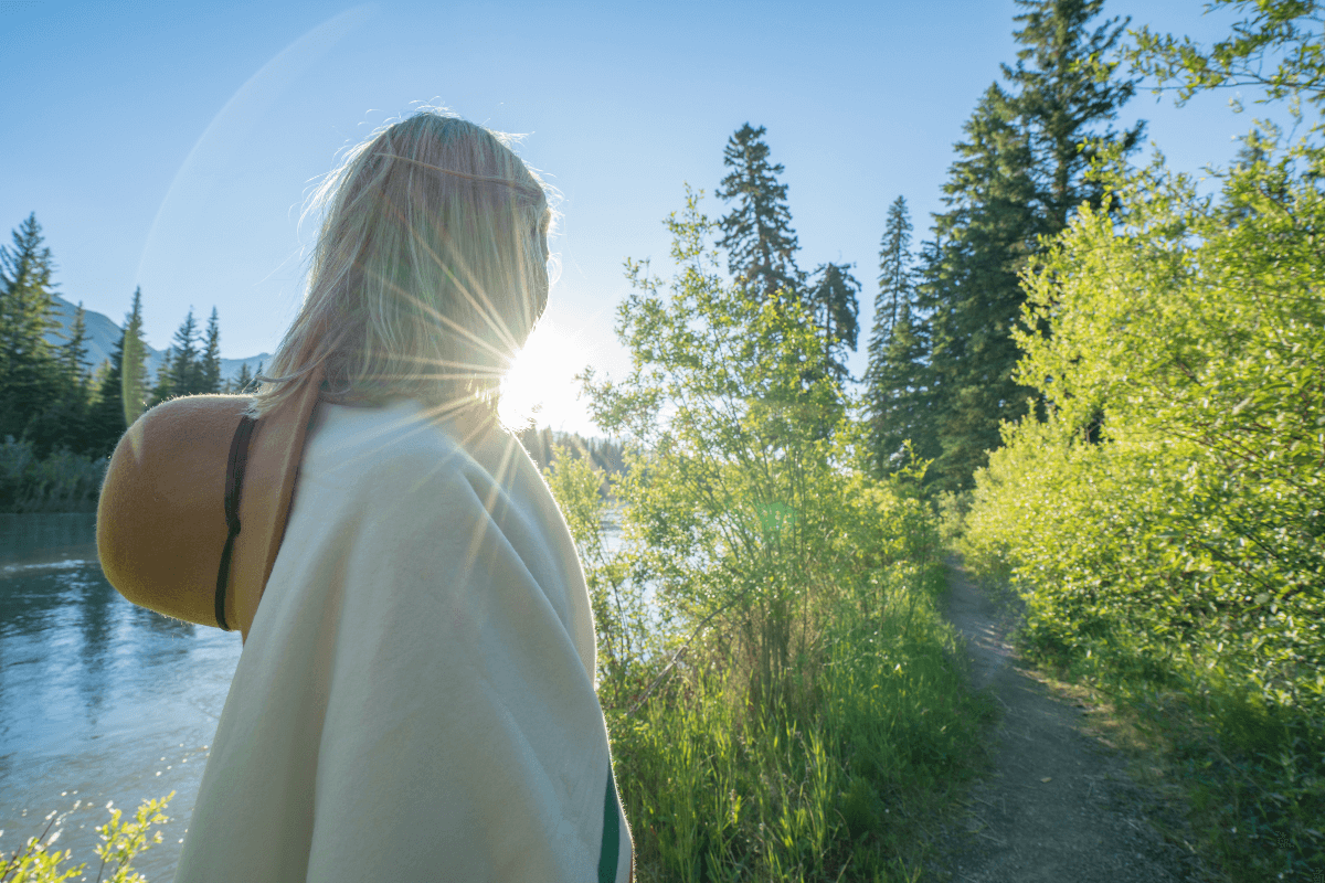 Midlife Woman in Nature Midlife Woman in Nature looking towards the sun, contemplating her future.
