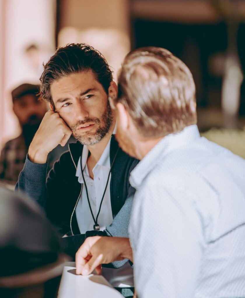 Grounded conversation between citizens Two people engaged in a thoughtful conversation, listening carefully and discussing ideas face to face.